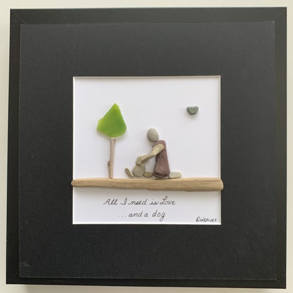 framed pebble art about happiness owning a dog