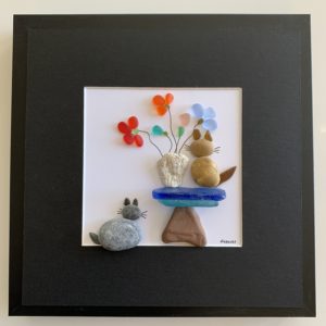 framed pebble and sea glass art of 2 cats and flowers