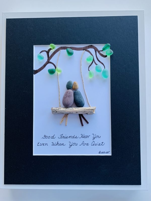 pebble art of 2 friends on a swing in a tree with the quote "Good Friends Hear You even when you Are Quiet"